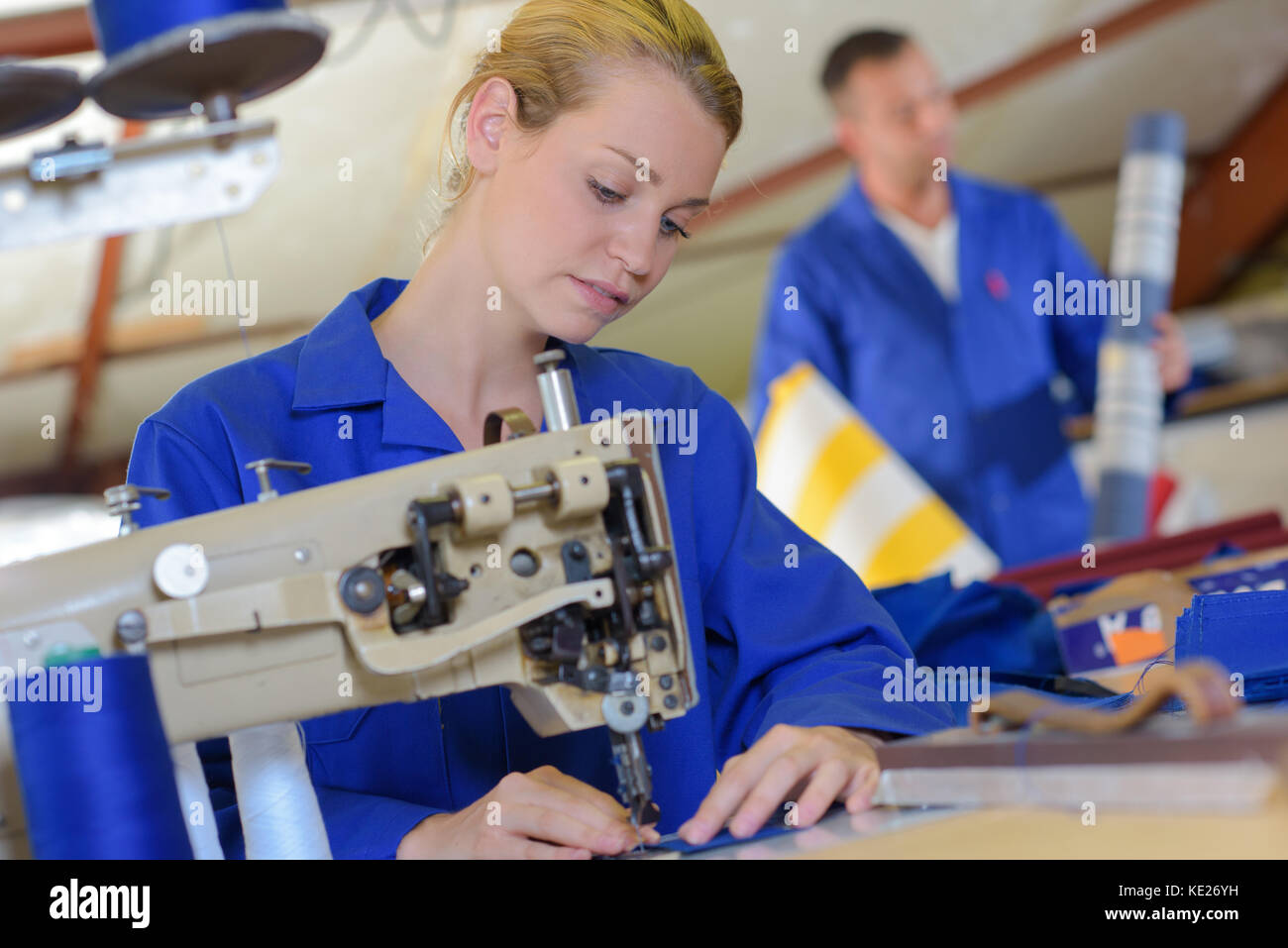 Woman using industrial sewing machine Stock Photo Alamy
