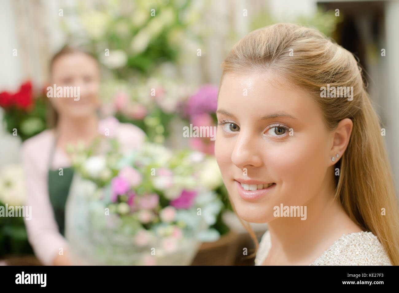 Customer about to pick up her flowers Stock Photo Alamy