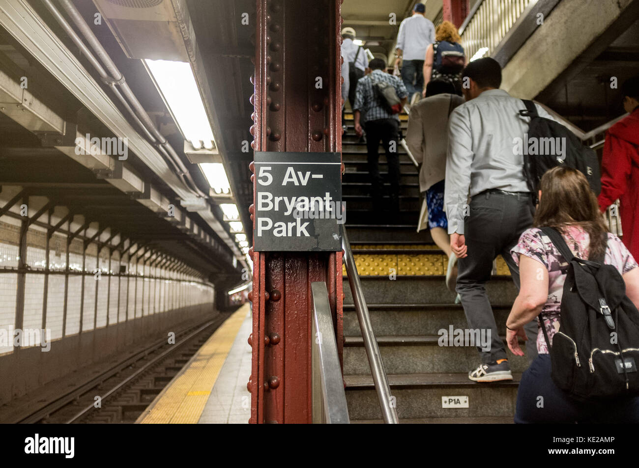 Passengers alighting staircase at 5th Avenue Bryant Park subway