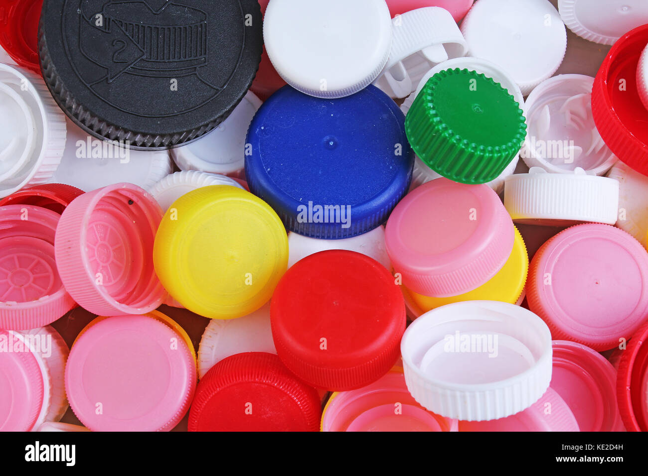 Plastic bottle caps. Closeup shot of stack of recyclable plastic