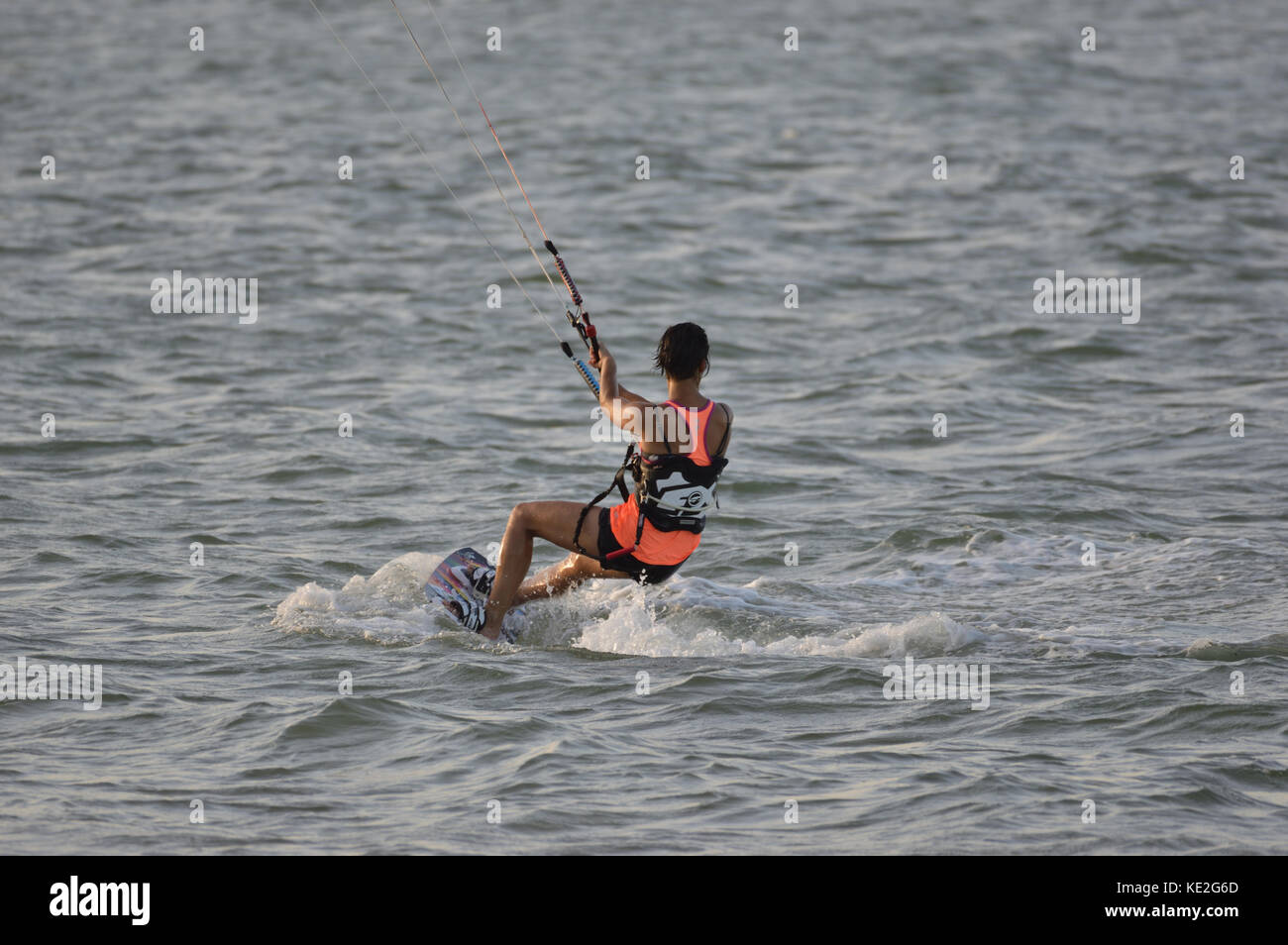 Female Kitesurfer in the sea in front of Kunduchi Beach Hotel north of Dar es Salem Tanzania Stock Photo
