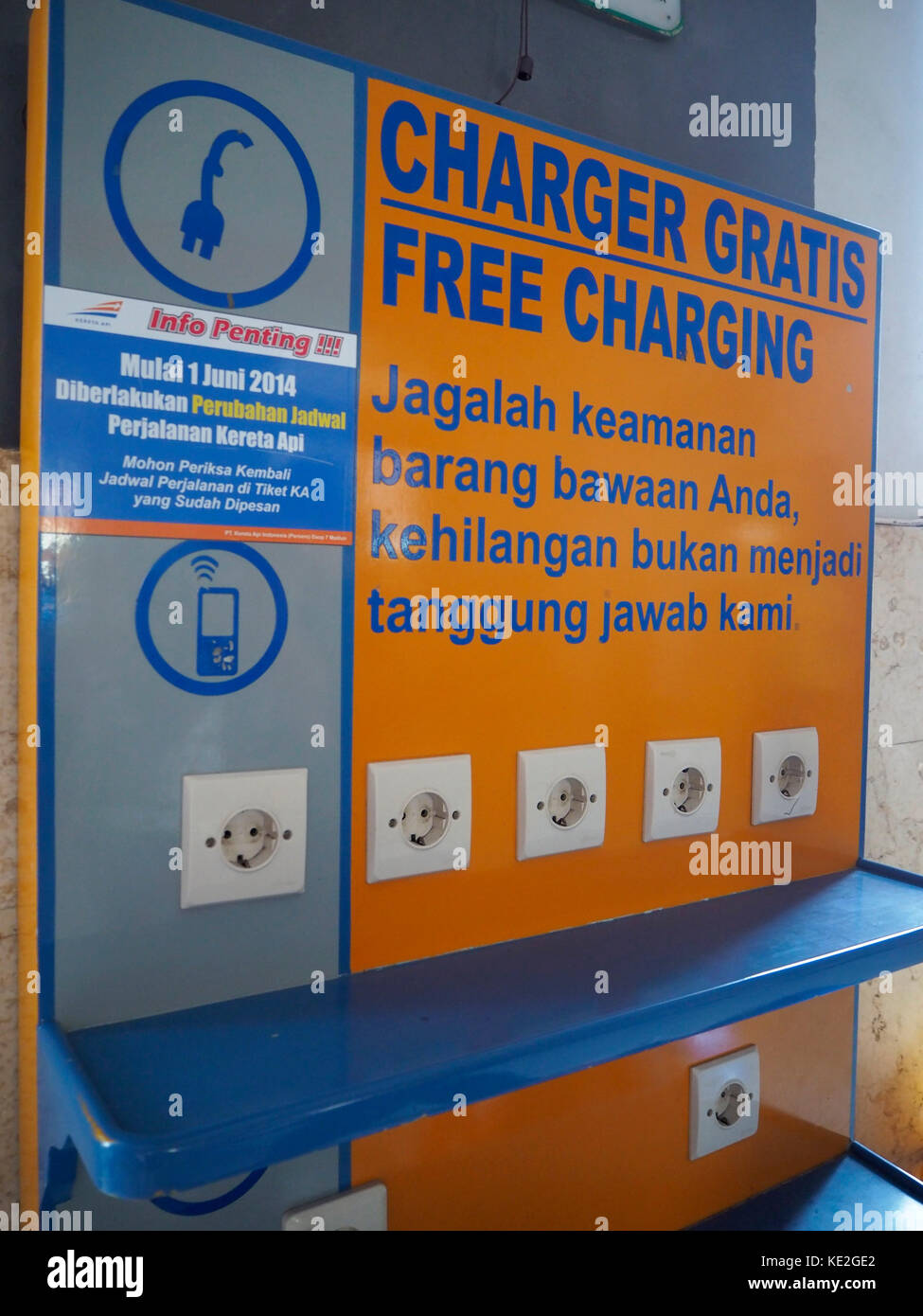 Free hand phone charging terminal at Kediri Train Station in Java, Indonesia. Stock Photo