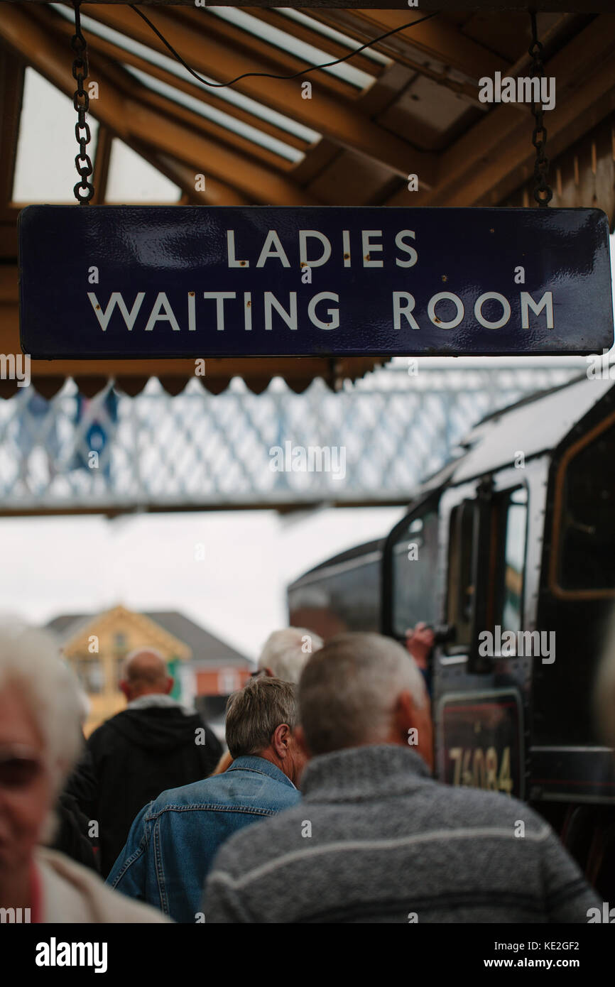 A sign hanging from a platform at a train station that reads, 'Ladies Waiting Room', UK Stock Photo