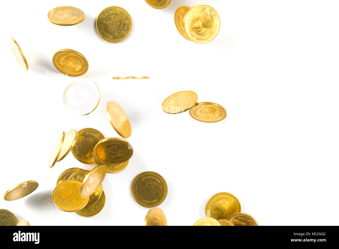Top view of Falling gold coins money isolated on the white background ...