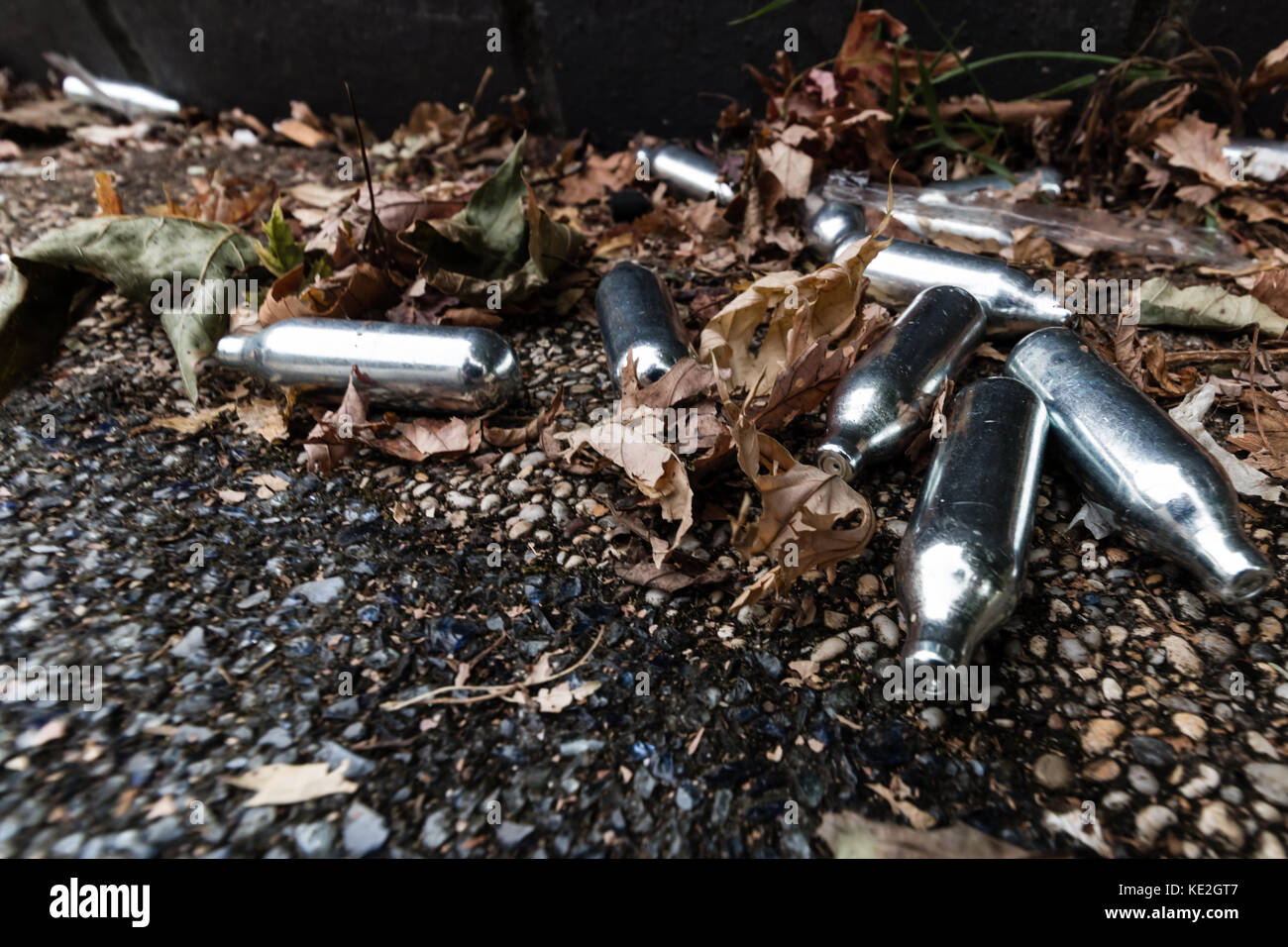 Discarded nitrous oxide canisters on the streets of Bristol Stock Photo