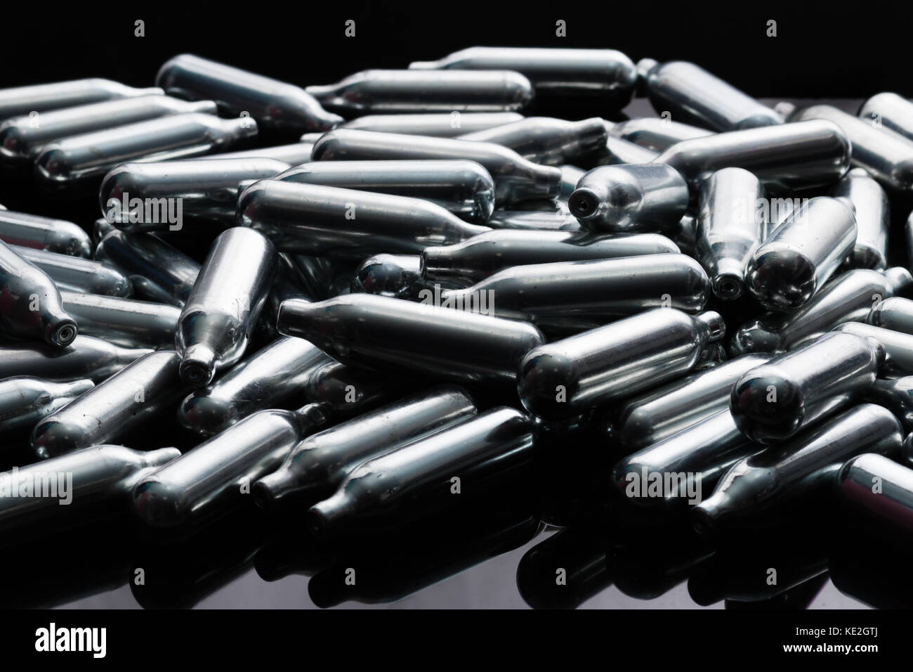 A pile of nitrous oxide canisters gathered from the street Stock Photo