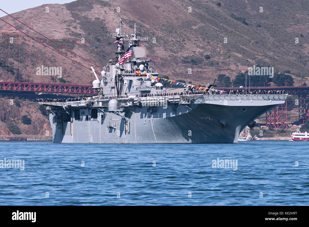 United States Navy Wasp-class amphibious assault ship USS Essex (LHD-2) passes through the Golden Gate. Stock Photo
