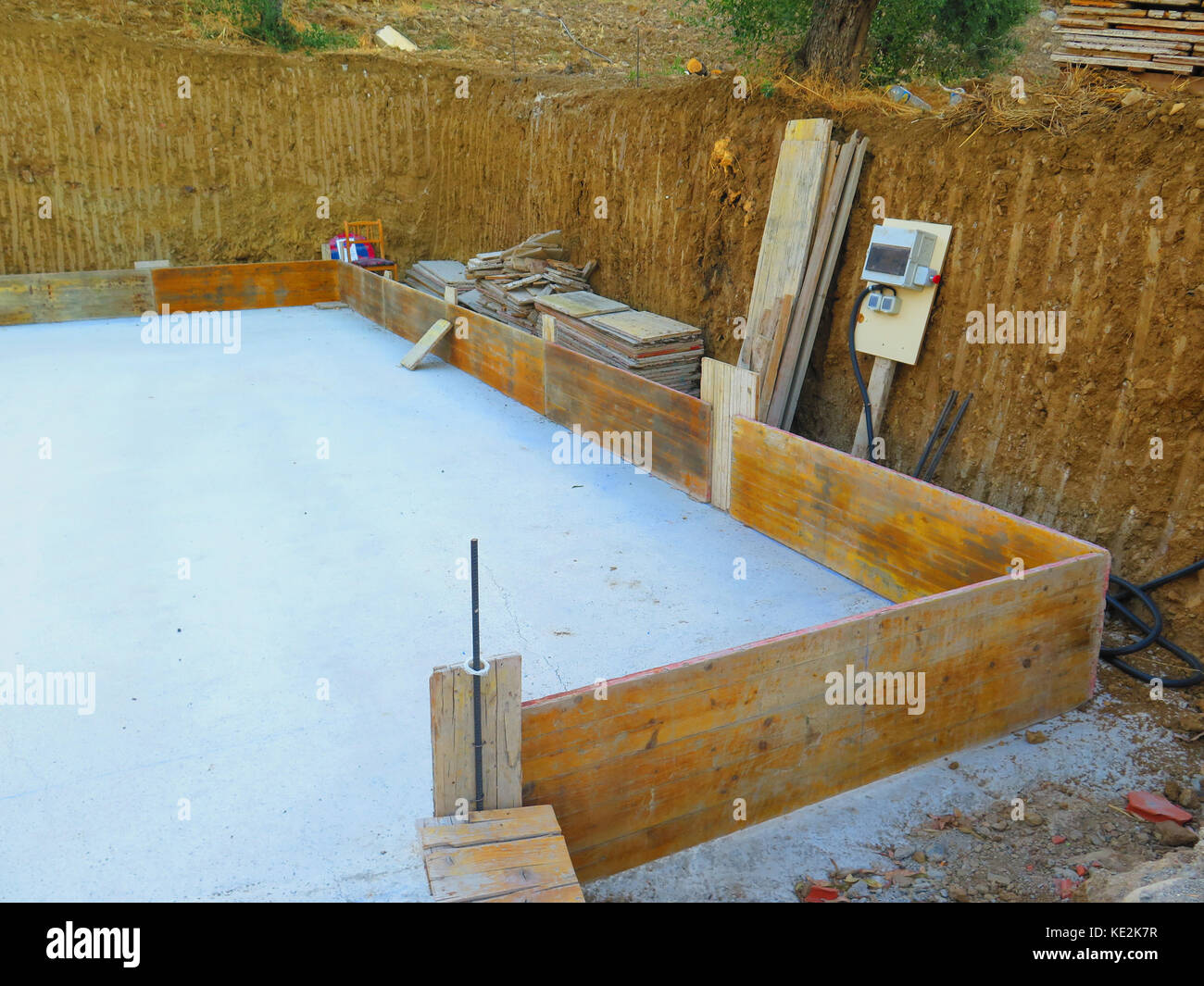 Concrete floor slab, shuttering and temporary electricity supply at dug out space for new house in Andalusian Village Stock Photo