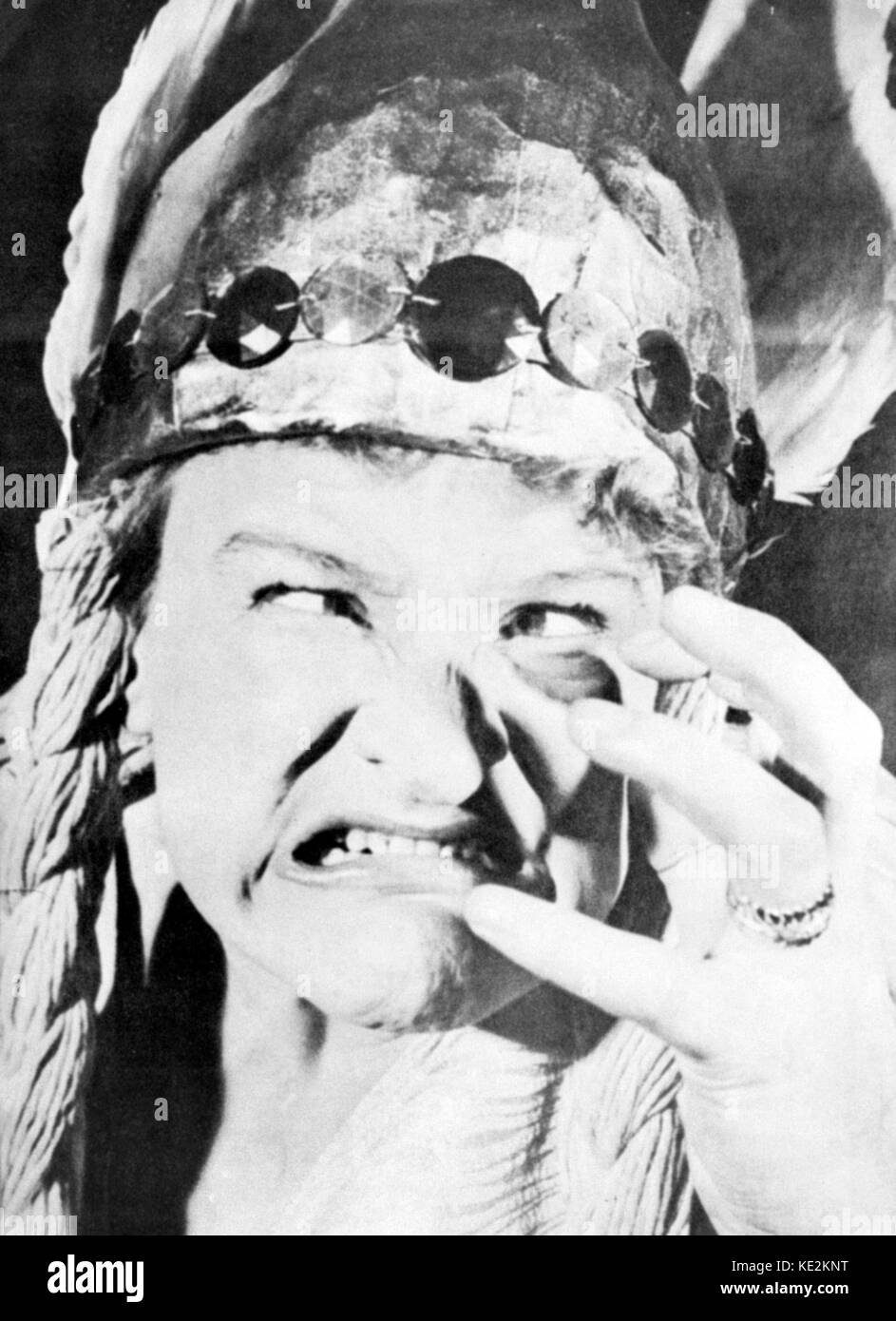 Anna Russell - close up portrait of the English comedian, actress and singer dressed up as a Wagnerian heroine b. 27 December 1911.  With long braids, a head dress.  Mocking.  Wagner.  Making a face.  Cross eyed. Stock Photo