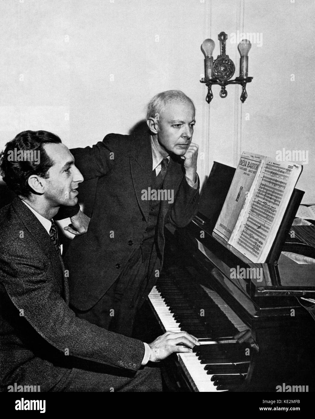 Gyorgy Sandor at the piano  with Bela Bartok.  Sandor is playing  a Bartok composition. Sandor was solist for premiere of Bartok 's Concerto No.3 for piano and orchestra on 8 February, 1946. Stock Photo