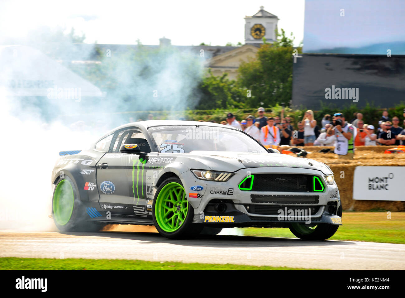 A Ford Mustang spins its wheels at the 2017 Goodwood Festival of Speed