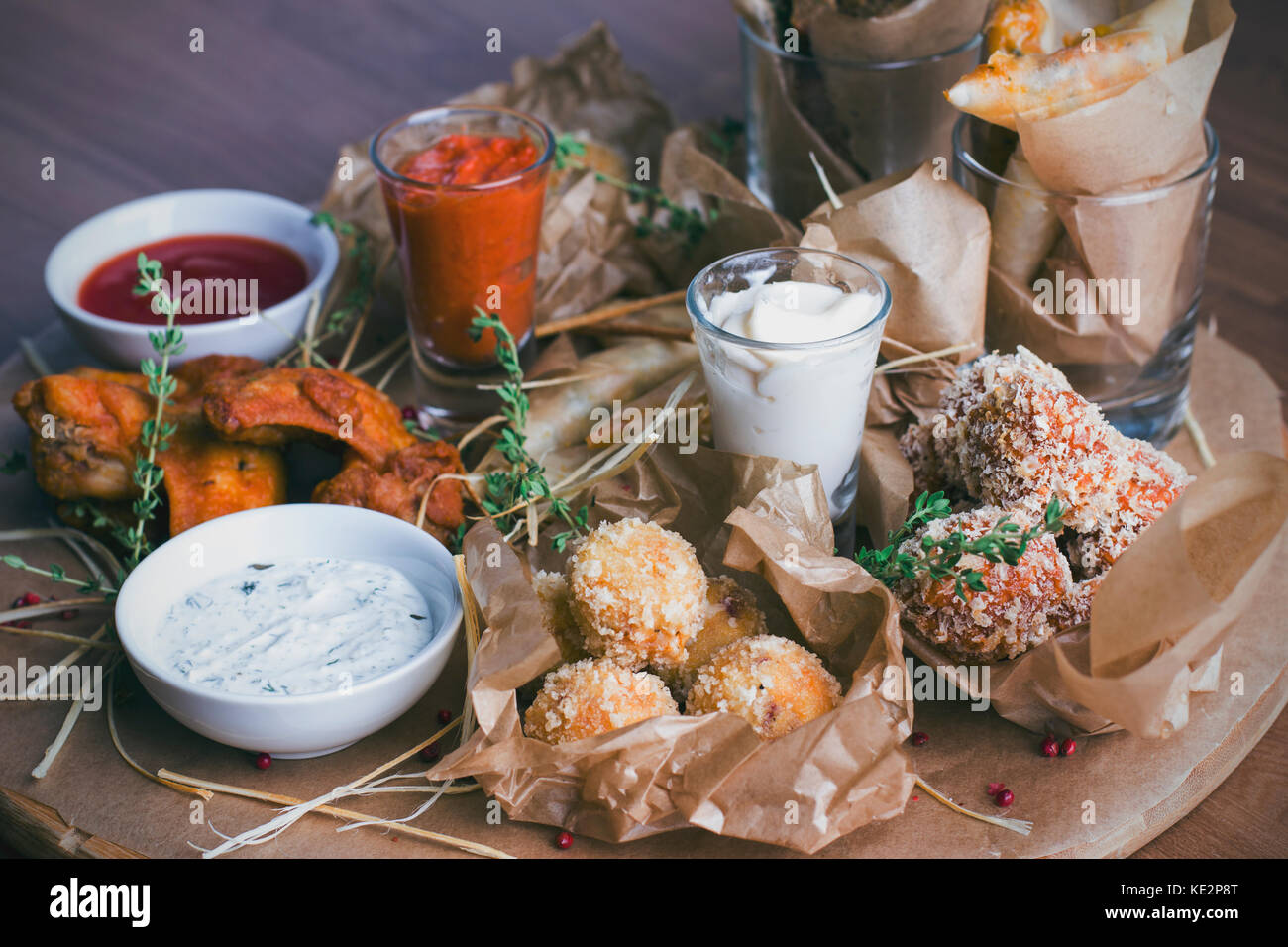Cheese balls tempura, spicy chicken wings and various snacks Stock Photo Alamy
