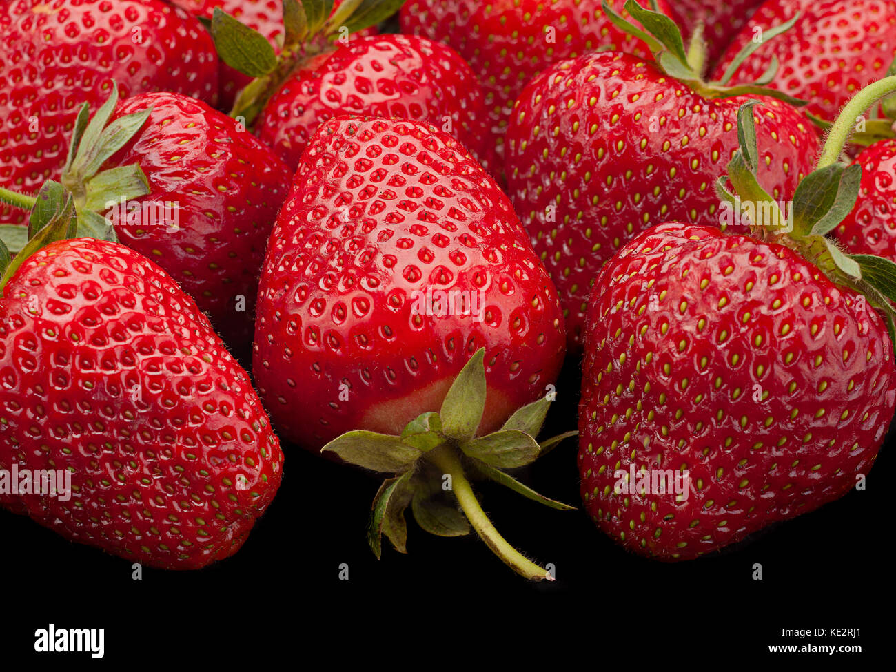 Ripe strawberry fruit berry closeup background Stock Photo - Alamy