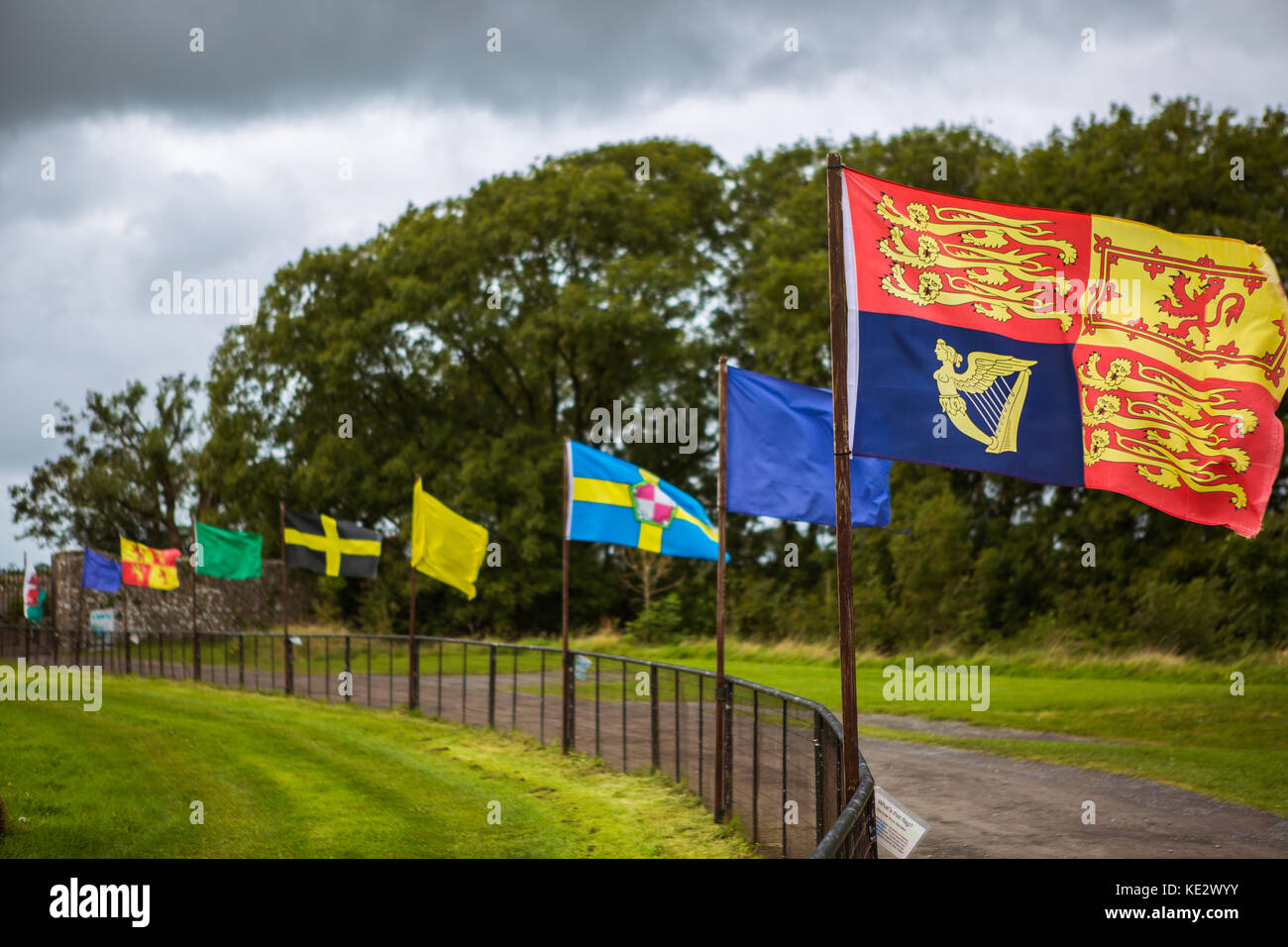 Row of historical flags at Carew Castle Stock Photo