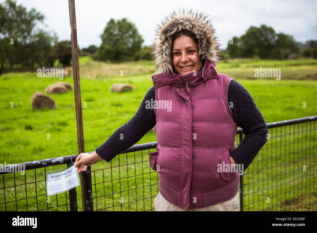 Middle aged lady in furry hood laughing Stock Photo