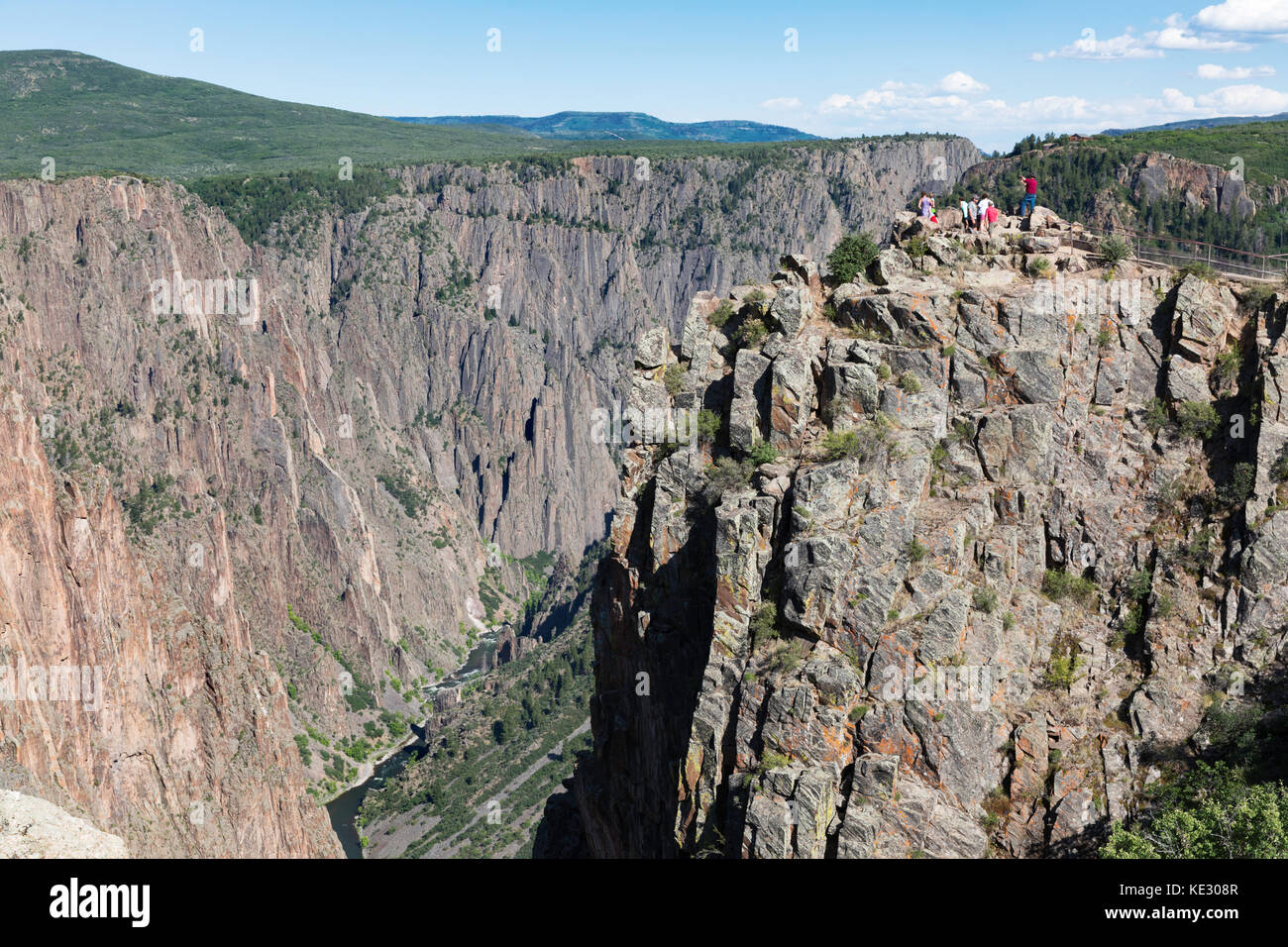 Tourists taking in the view of Black River and Black Canyon of the Gunnison, Black Canyon of the Gunnison National Park, Colorado, USA Stock Photo