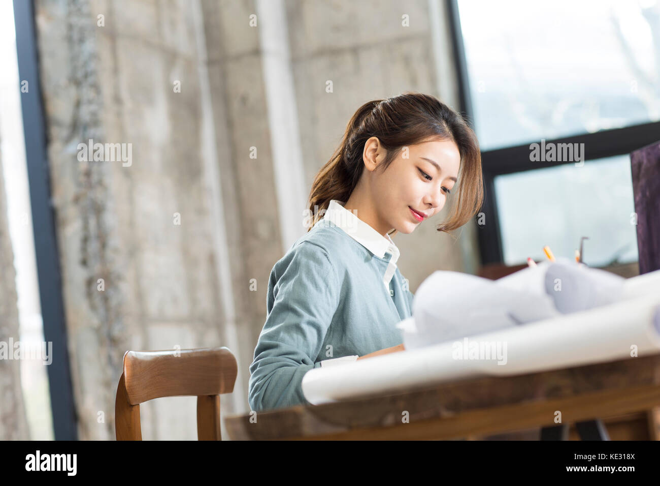 Side view portrait of young smiling female car designer at work Stock ...