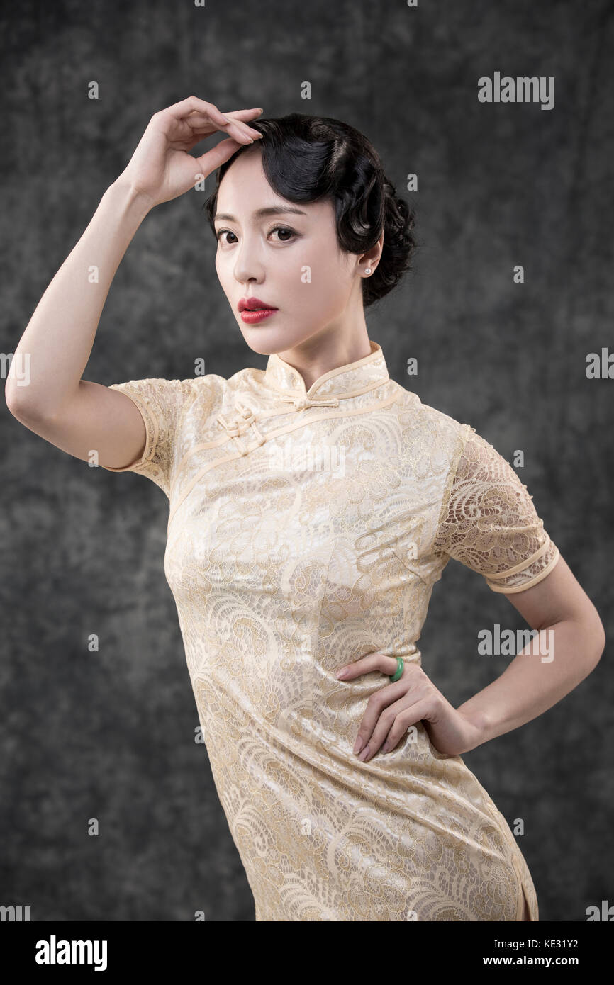 Young woman in retro-style oriental clothes posing Stock Photo