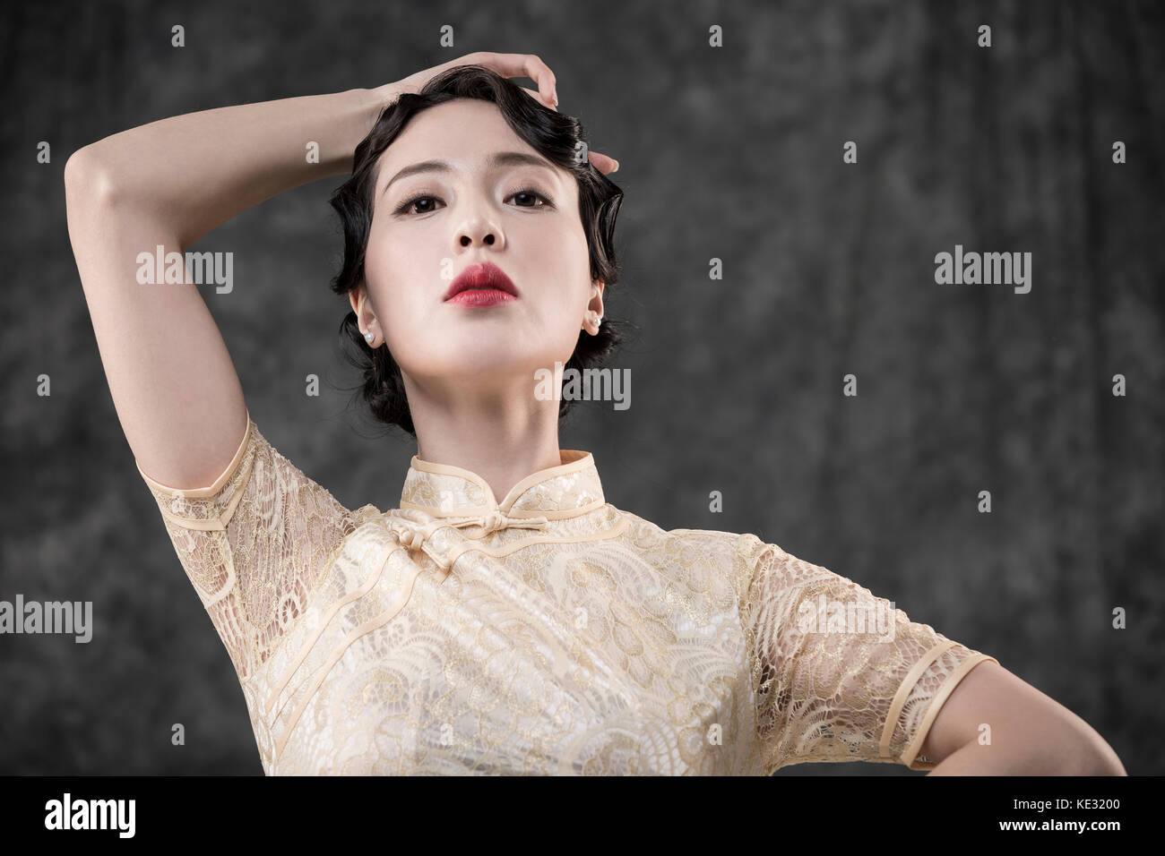 Portrait of young woman in retro-style oriental clothes posing Stock Photo