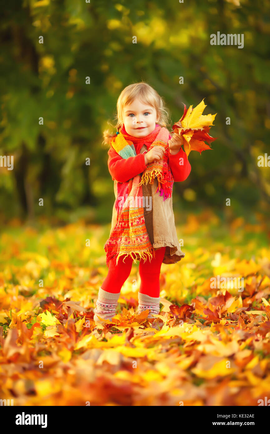 Happy little girl in the park Stock Photo - Alamy