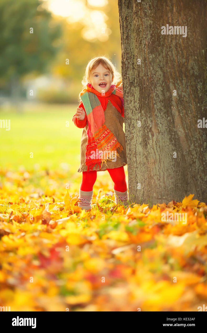 Happy little girl in the park Stock Photo - Alamy