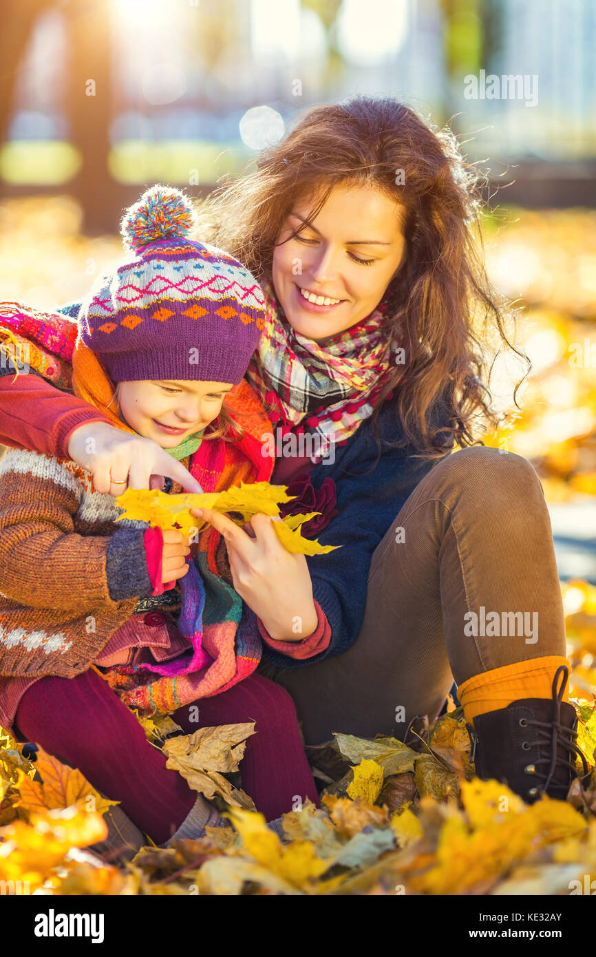 Mother and daughter in the autumn park Stock Photo - Alamy