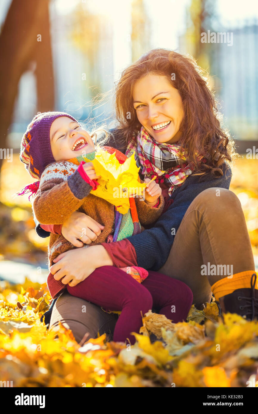 Mother and daughter in the autumn park Stock Photo - Alamy