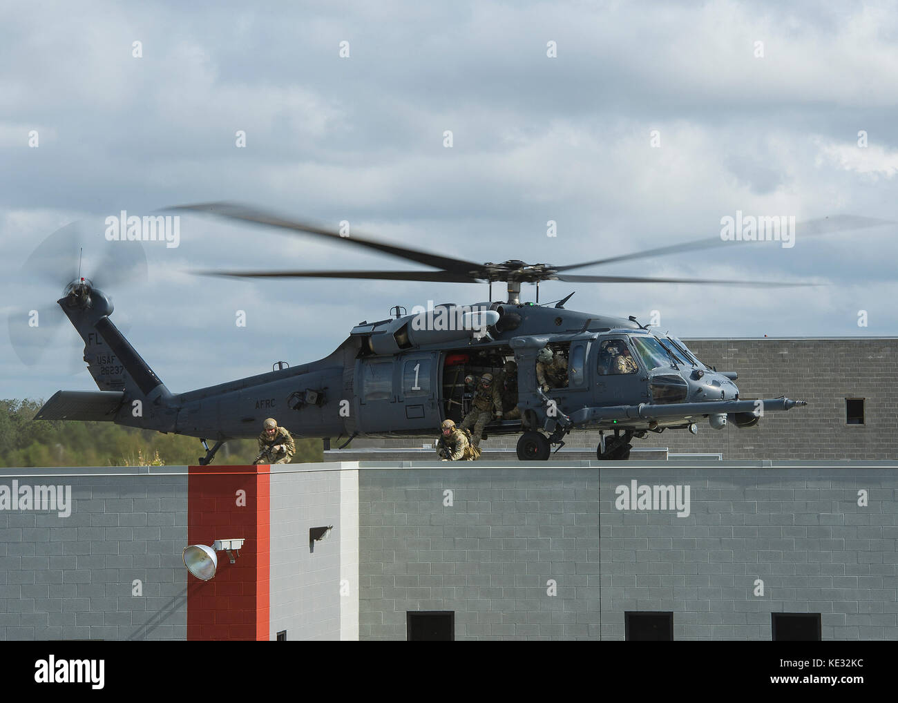 Members of the U.S. Army 20th Special Forces Group infill via a U.S. Air Force HH-60 Pave Hawk helicopter Stock Photo
