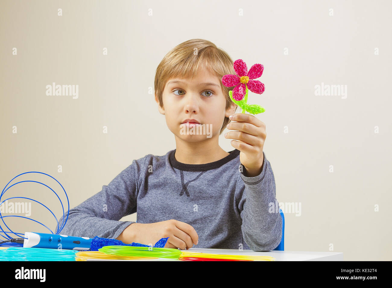 Kid with 3d printing pen created a flower Stock Photo - Alamy