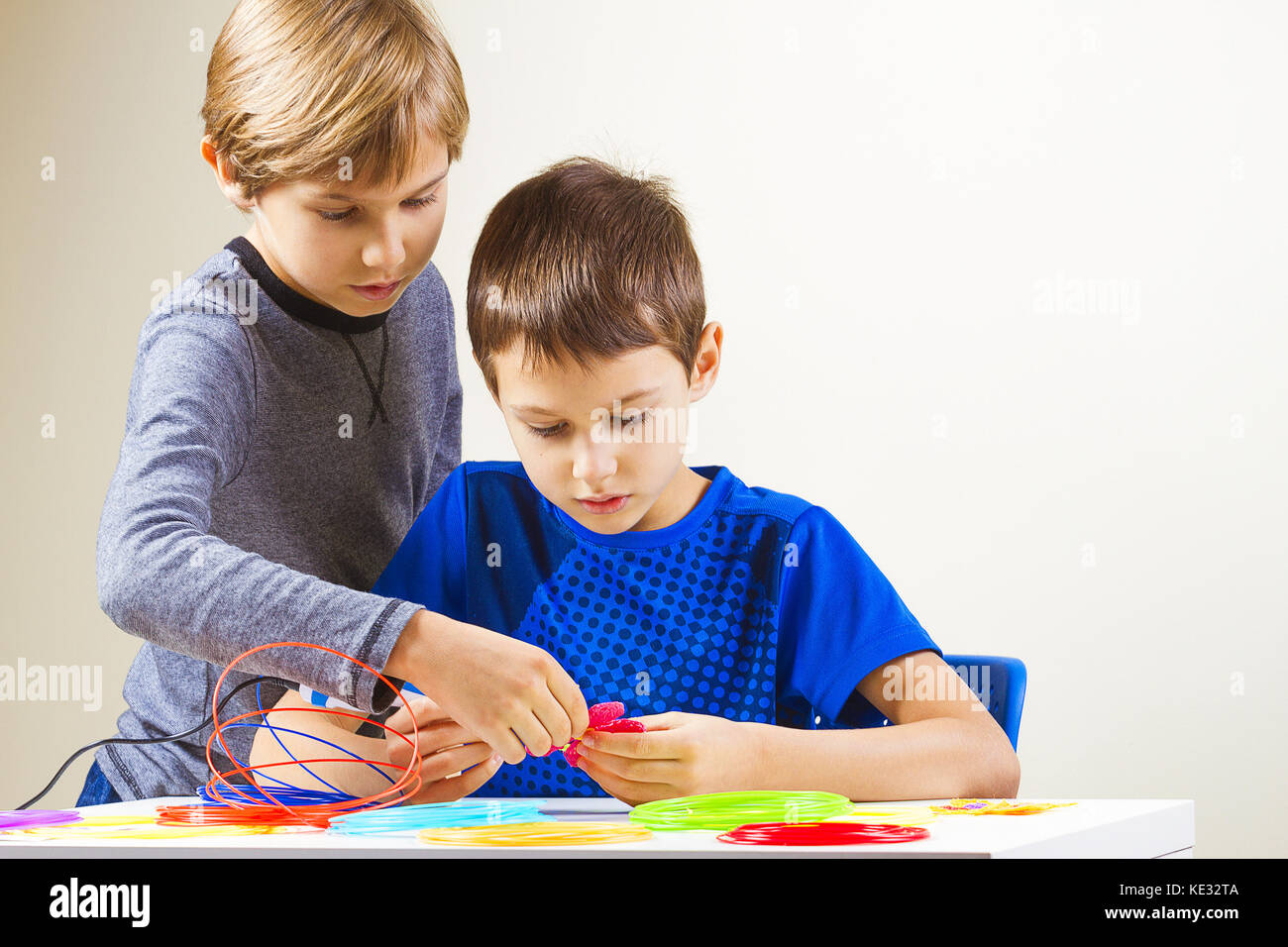 Children creating with 3d printing pen Stock Photo - Alamy