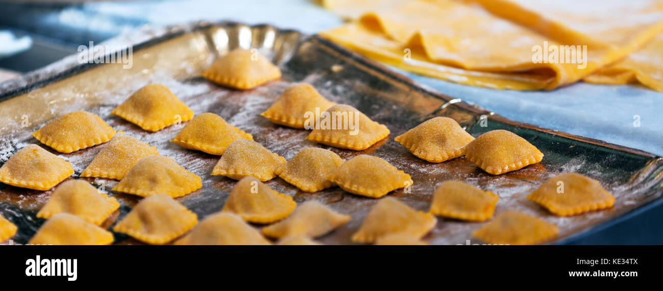 Fresh homemade ravioli pasta on tray. Long wide banner Stock Photo - Alamy