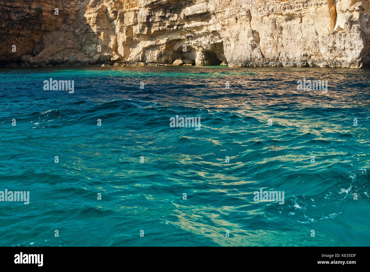 Crystal clear waters off the coastal cliffs of Comino in Malta. Stock Photo