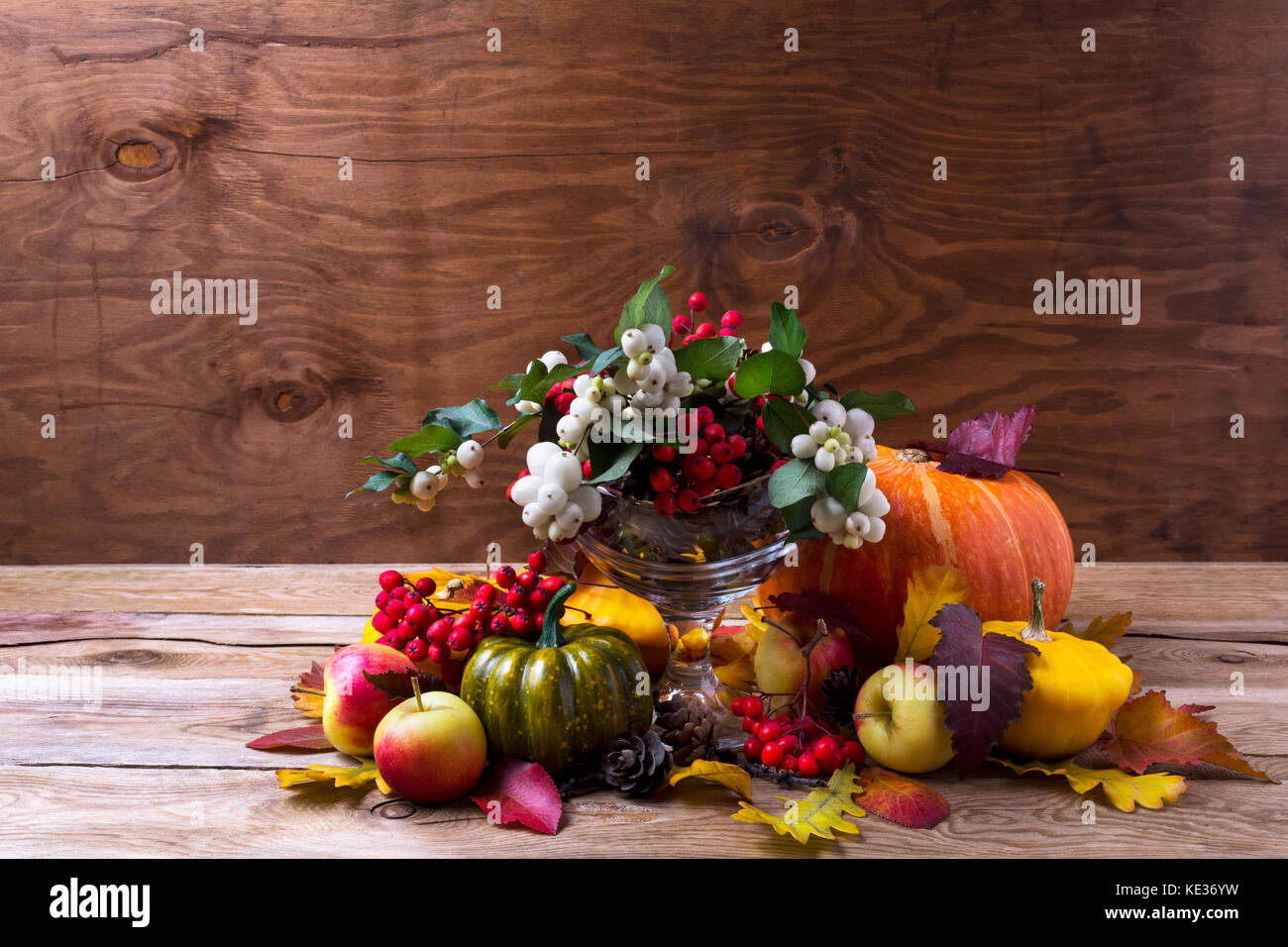 Thanksgiving table centerpiece with snowberry and rowan berries in ...