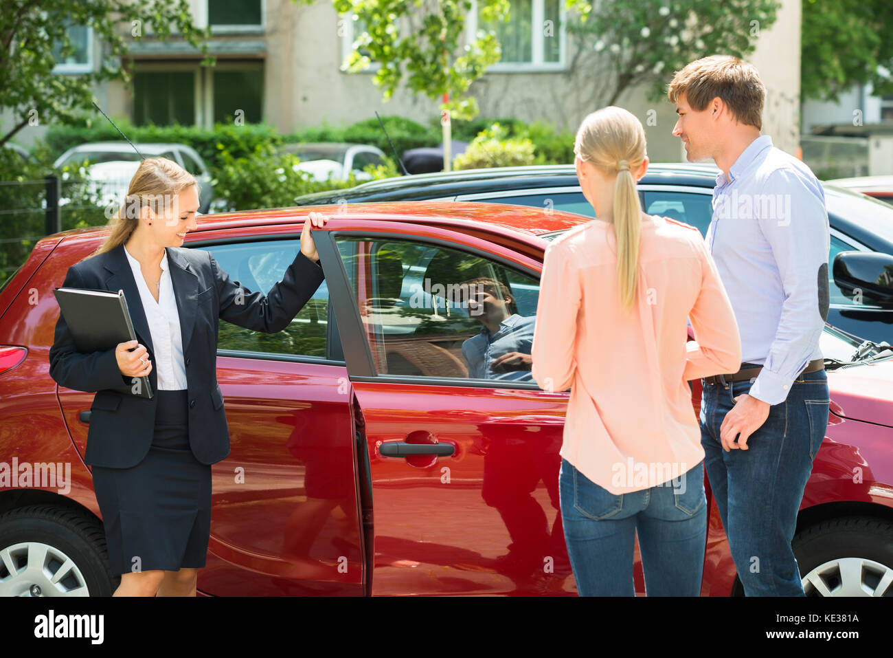 Salesman showing car client hi-res stock photography and images - Alamy