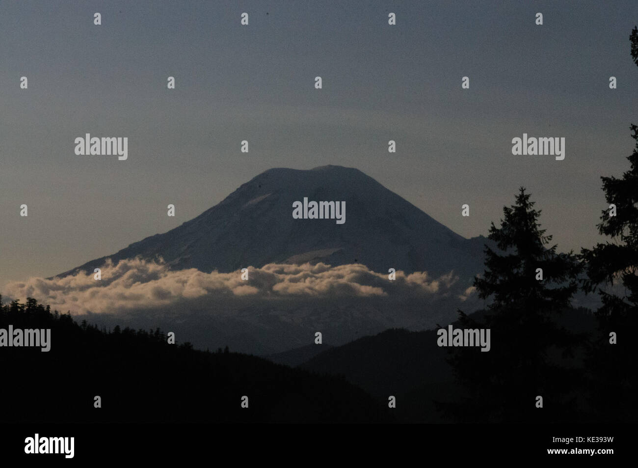 Mount Rainier shrouded in Clouds Stock Photo - Alamy