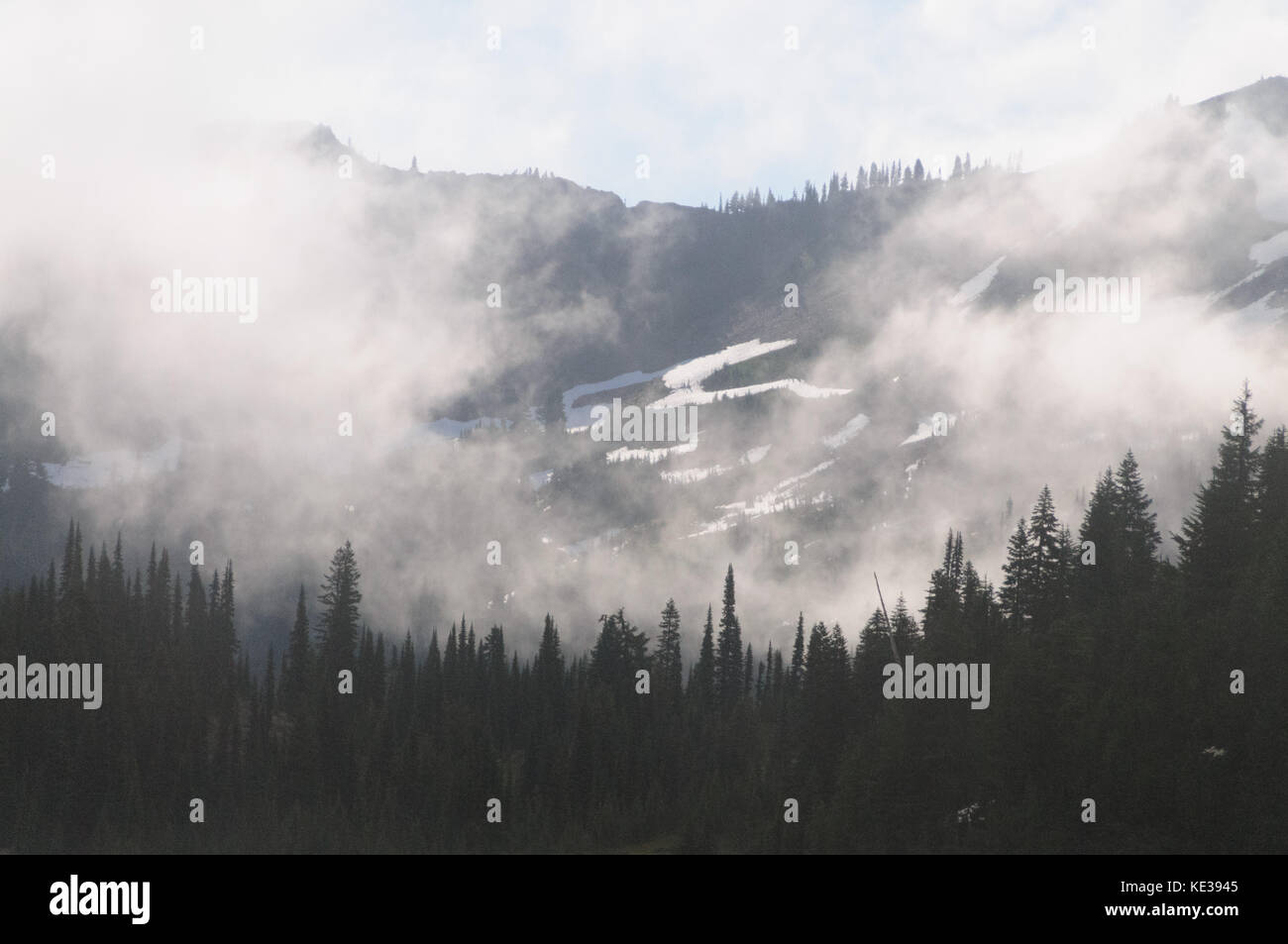 Mount Rainier shrouded in Clouds Stock Photo - Alamy
