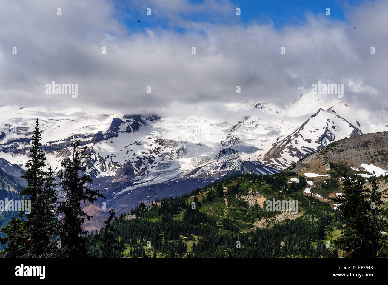 Mount Rainier shrouded in Clouds Stock Photo - Alamy