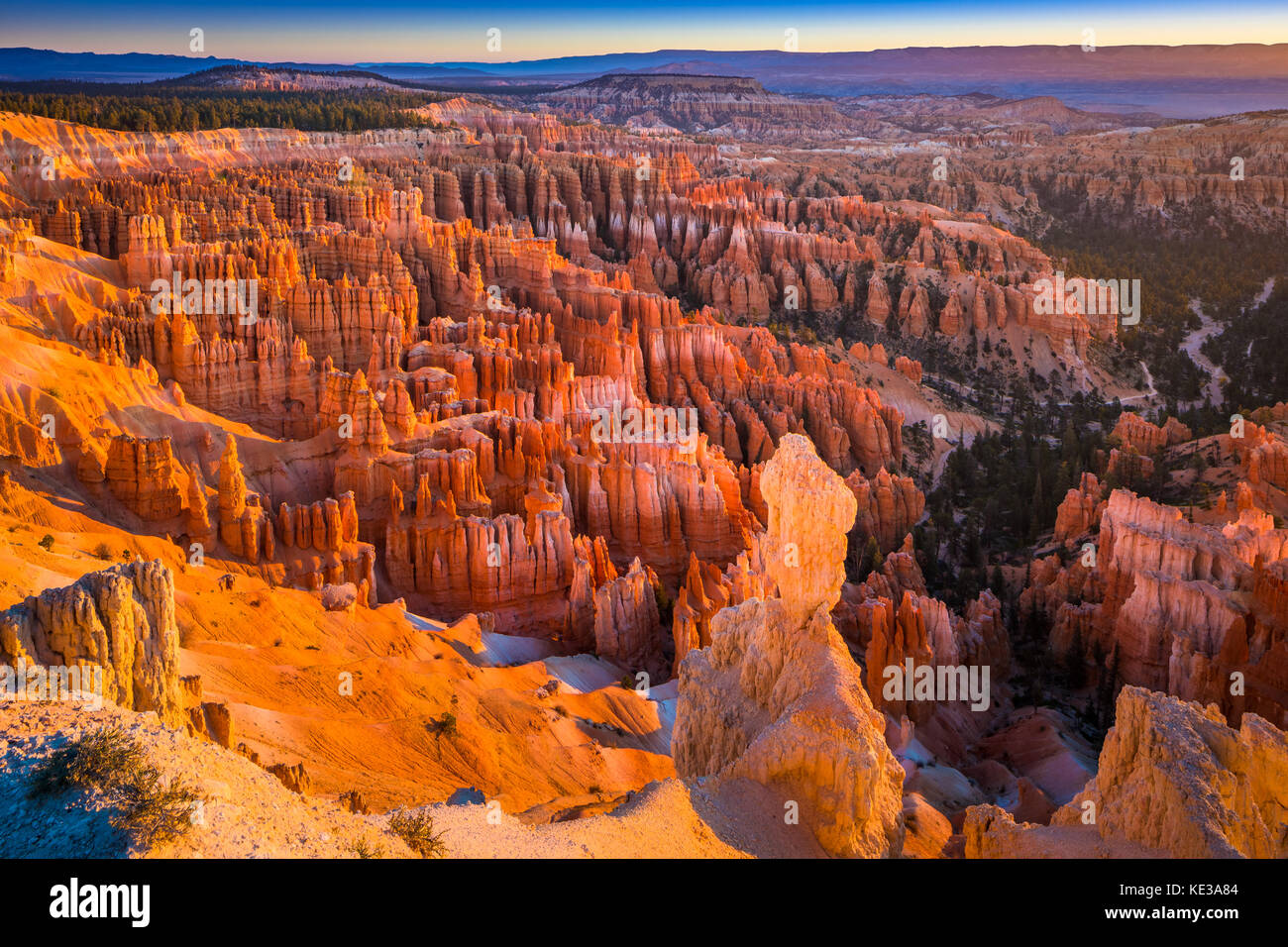 Bryce Canyon National Park, a sprawling reserve in southern Utah, is known for crimson-colored hoodoos, which are spire-shaped rock formations. Stock Photo
