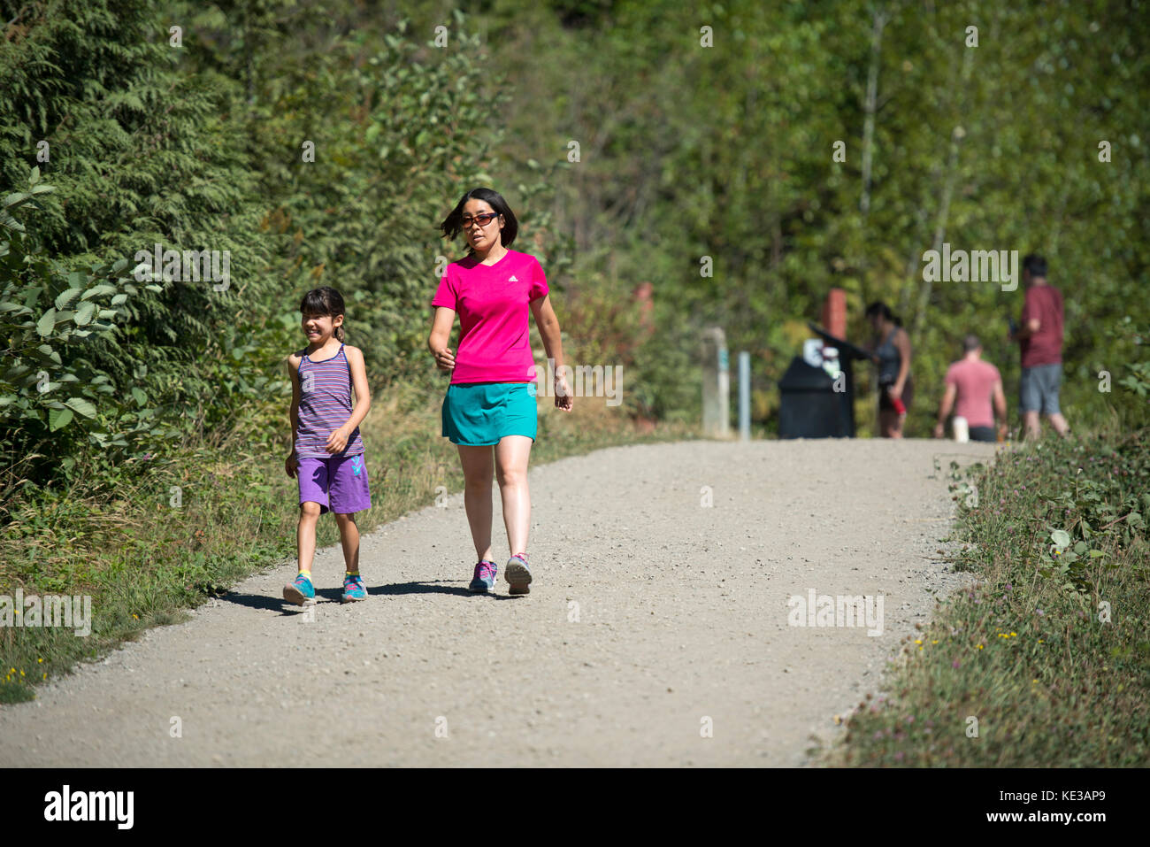 Mother and daughter walking the Coquitlam Crunch, Coquitlam, BC, Canada Stock Photo