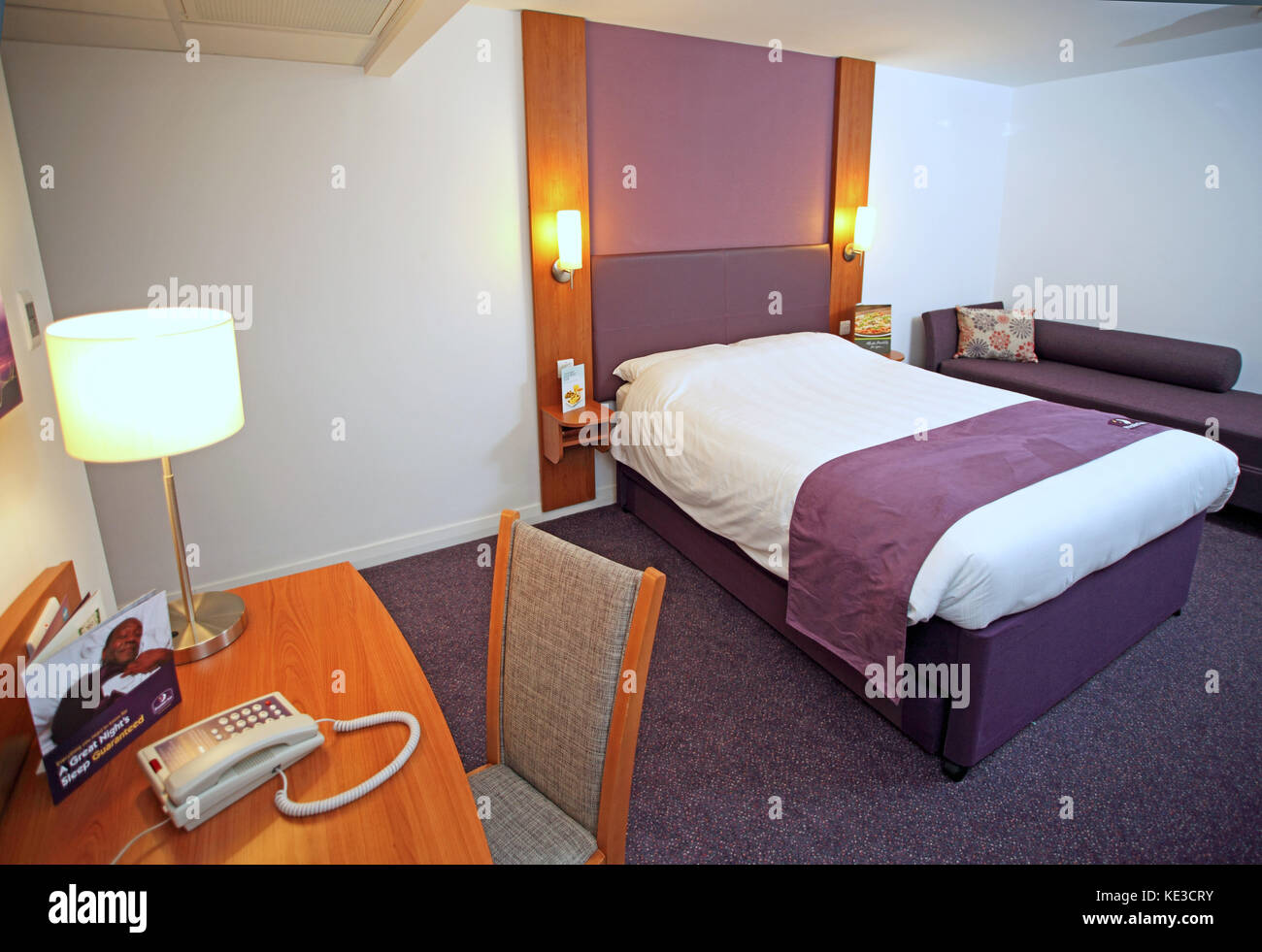 Interior of a bedroom in a newly completed Premier Inn Hotel in Maidstone, Kent, UK. Converted from an existing office block. Stock Photo