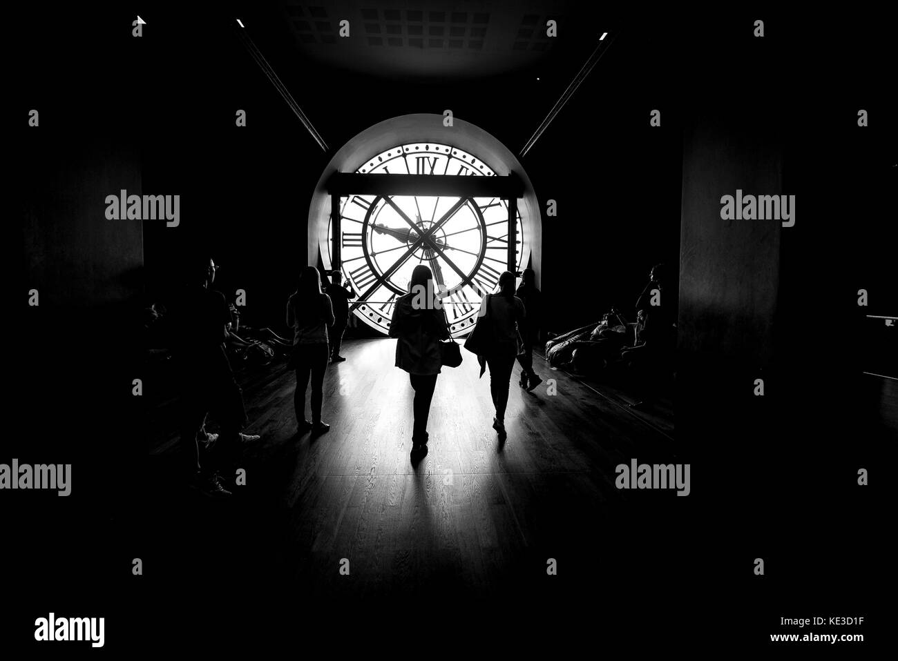 Silhouette against the clock face at the Musee D'Orsay in Paris Stock Photo