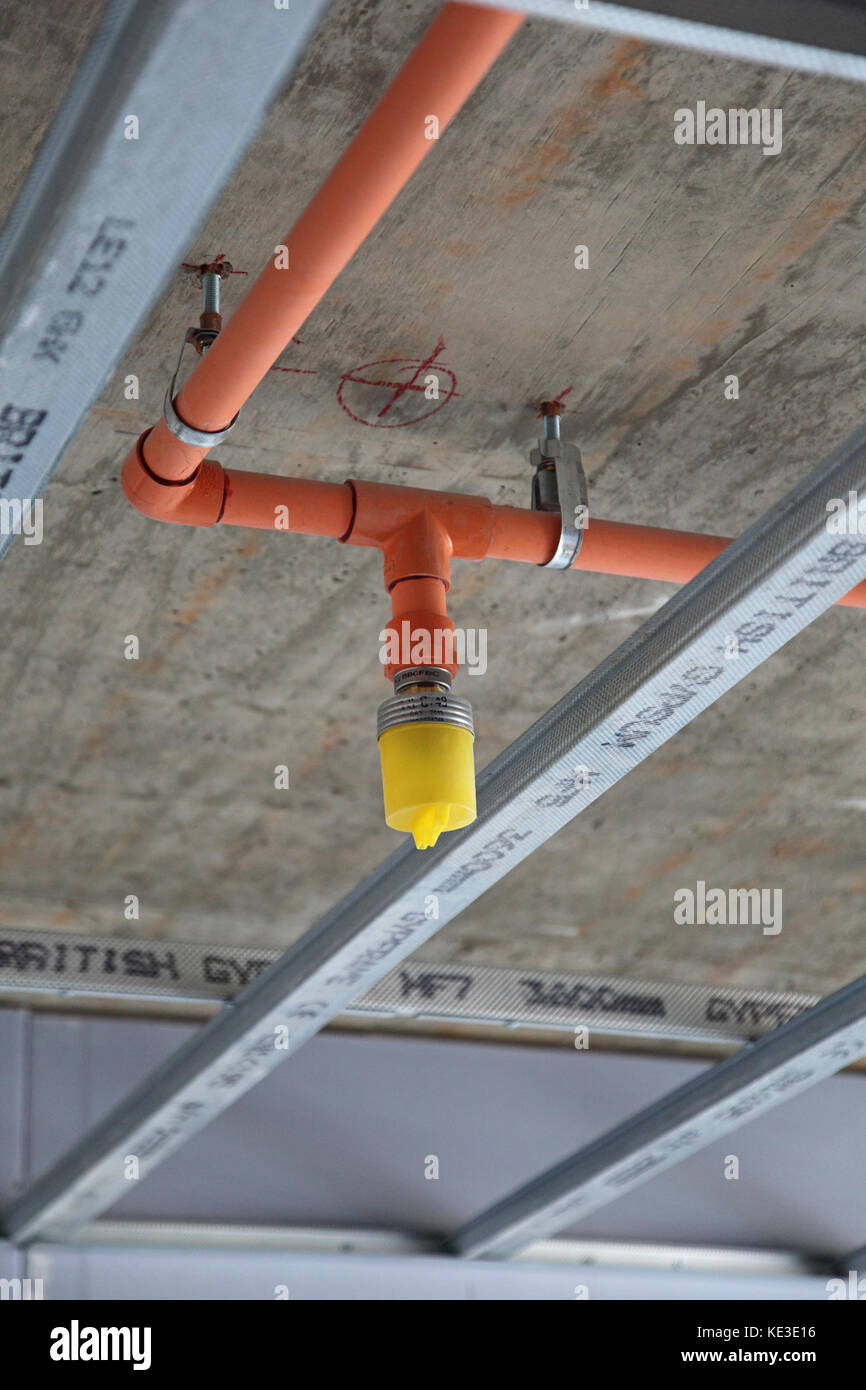 Newly installed fire sprinker system shown during the construction of a new residential block in North London, UK Stock Photo