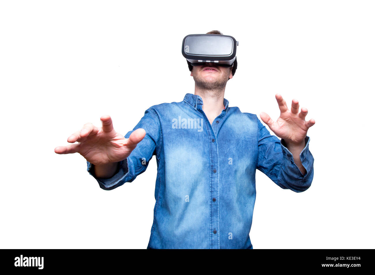 Closeup of bearded young man wearing virtual reality goggles ...