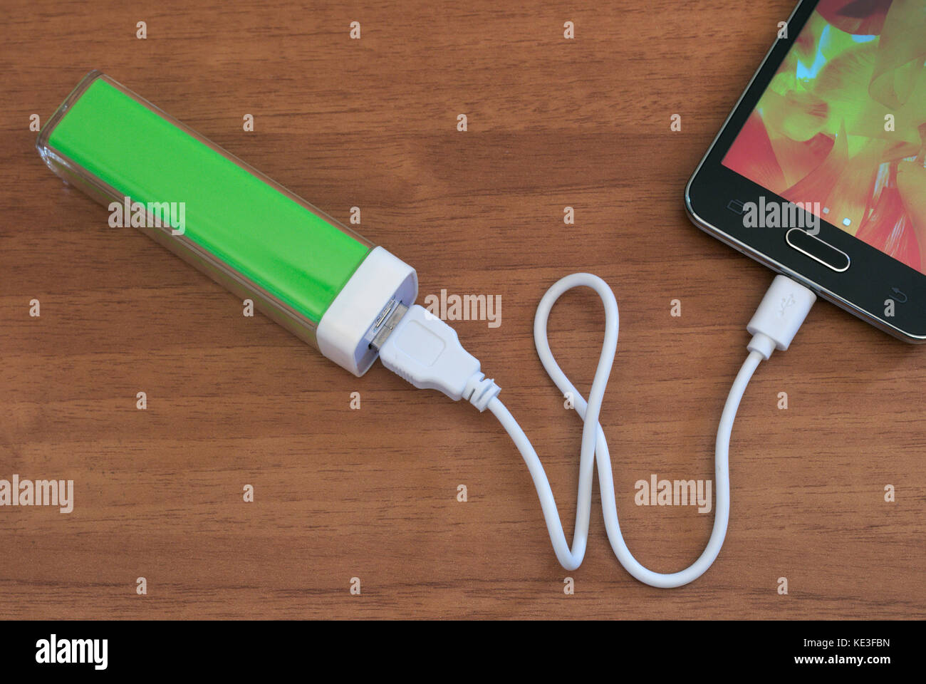 Smartphone charging with power bank Stock Photo Alamy