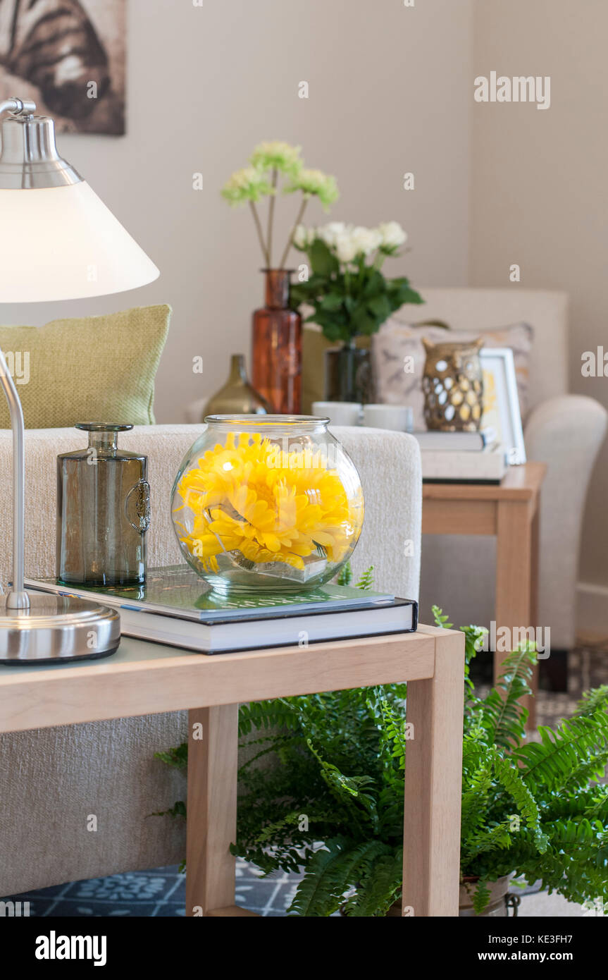 yellow flowers in a bowl, modern living room Stock Photo