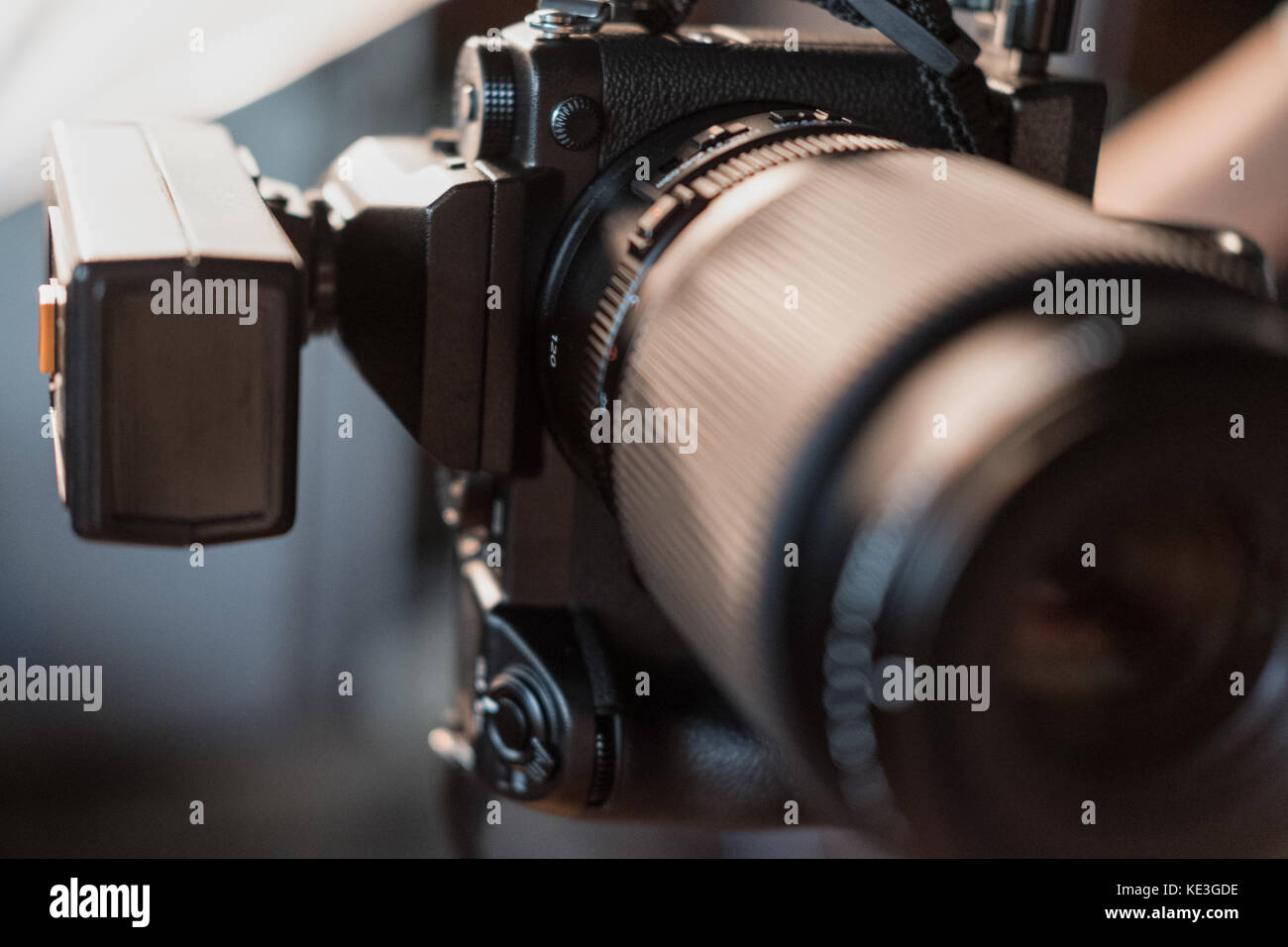 digital camera with flash close-up against a background of bright ...