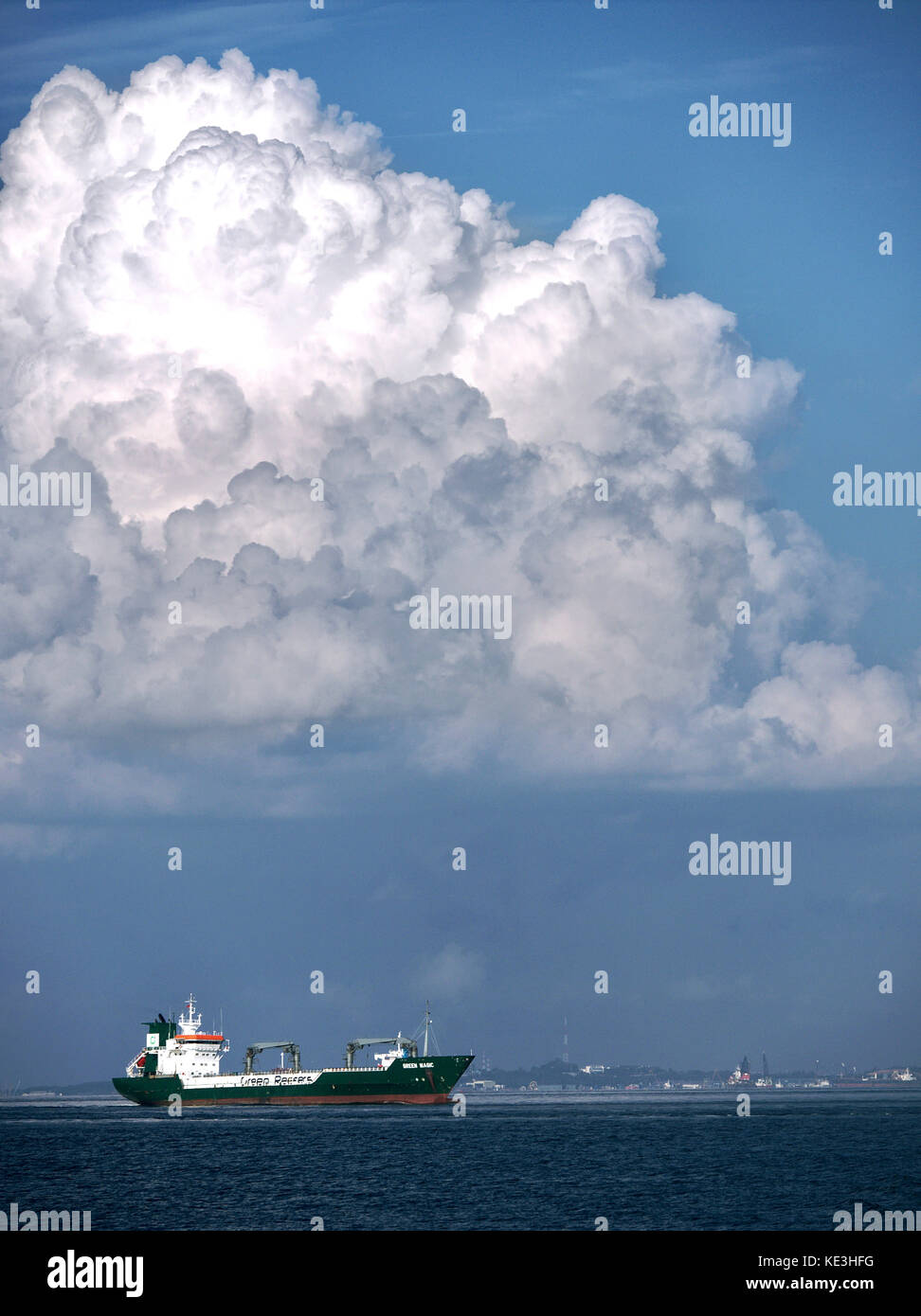 Bahamas flagged Refrigerated Cargo Ship, Green Magic, cruising through waters off Singapore Straits Stock Photo