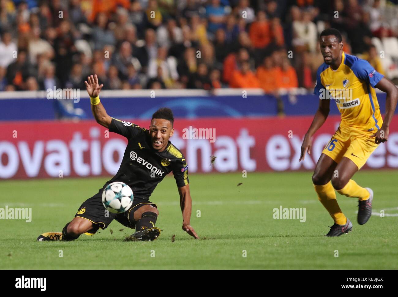 Nicosia, Cyprus. 17th Oct, 2017. Bortussia Dortmund's Pierre-Emerick Aubameyang (L) vies for the ball during the 2017-2018 Champions League match against Apoel in Nicosia, Cyprus, Oct. 17, 2017. The match tied 1-1. Credit: Sakis Savvides/Xinhua/Alamy Live News Stock Photo