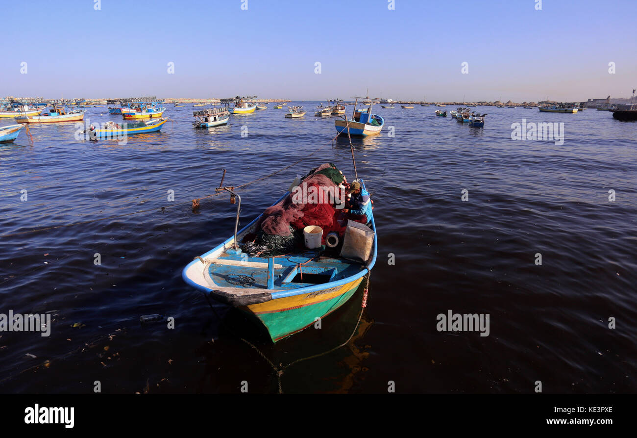 October 18, 2017 - Gaza City, Gaza Strip, Palestinian Territory - Palestinian fishermen set off for the sea in Gaza City on October 18, 2017 on the first day that fishermen will be allowed by Israel to travel up to nine nautical miles. Israeli officials have announced they will temporarily expand the fishing area for Palestinians off a sector of the blockaded Gaza Strip. Around 4,000 fishermen work in Gaza, more than half of whom live below the poverty line. Israel has imposed a blockade of the Hamas-run Gaza Strip for a decade, while Egypt has also largely closed its border with the isolated Stock Photo