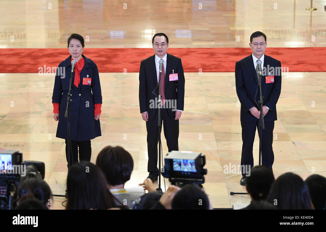 Beijing, China. 19th Oct, 2017. (L-R) Jiang Yan, Kang Hongpu and Liu Zongfu, delegates to the 19th National Congress of the Communist Party of China (CPC), receive interview at the Great Hall of the People in Beijing, capital of China, Oct. 19, 2017. Credit: Wang Jianhua/Xinhua/Alamy Live News Stock Photo